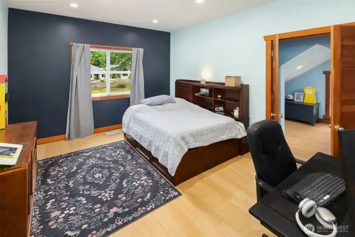 One of the bedroom on the upper level. Note the bonus room, currently used as a bedroom