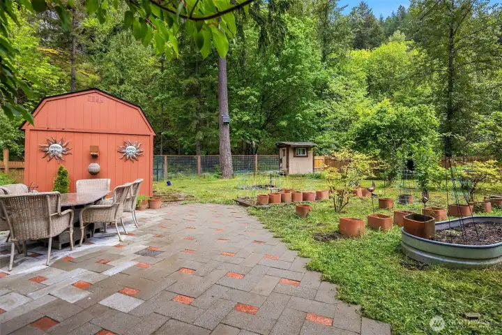 Established apple trees and grape vines (Arbor in 2019)  Productive vegetable garden  Blueberry bushes, kiwi, rhubarb, raspberries, persimmons, and strawberries  Rabbit Barn and Chicken Coop. Firepit