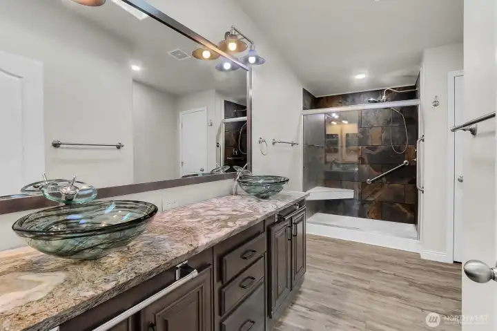 Primary en-suite with double vanity and large storage/linen closet