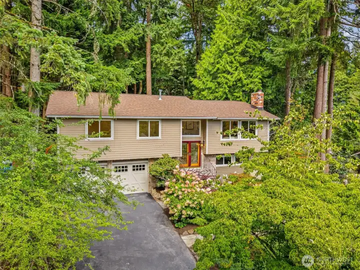 Front of home, double doors, wide porch, warm entry