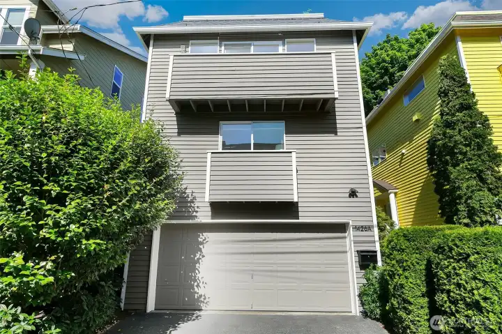 Standalone city home with no shared walls and a private garage below.
