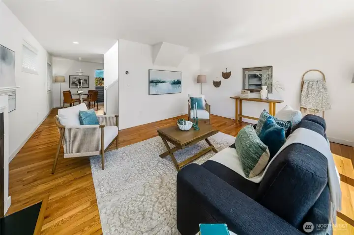 Open upper living level with kitchen, dining and living spaces connected.