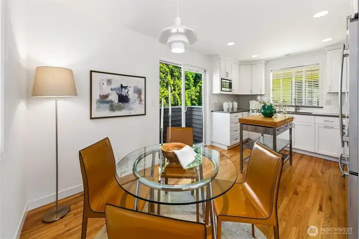 Dining area connected to the kitchen and upper living level.