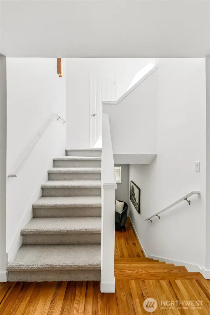 Indoor living extends naturally to the rooftop terrace, with a powder room thoughtfully tucked along the way.
