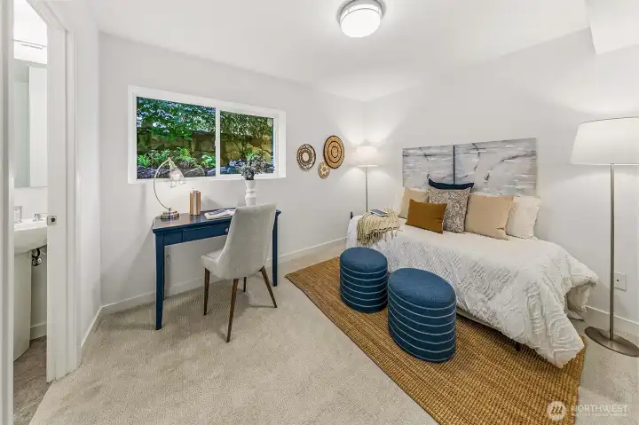Large third bedroom/office includes an internal half bath, with plumbing framework for possible future shower expansion.