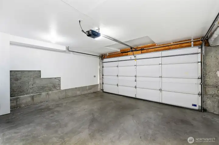Private two-car garage with storage and EV-ready charging.