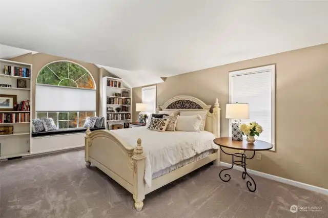 The elegant primary bedroom is located on the second level and has ample room for large furniture. Built-in book shelves allow for your own convenient private library.