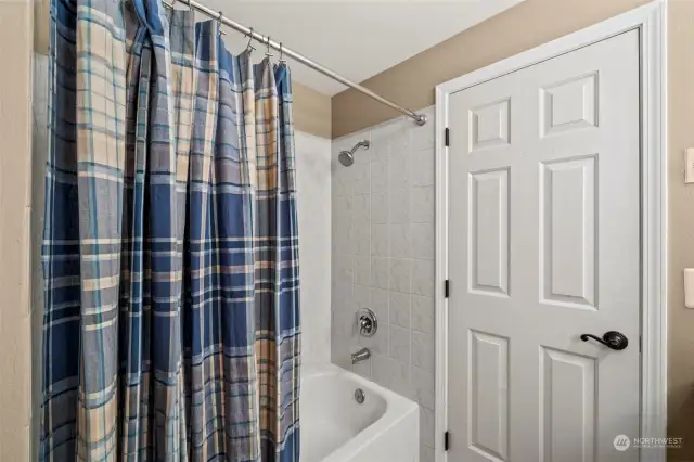 The jack-n-jill bathroom includes a tub/shower combination.