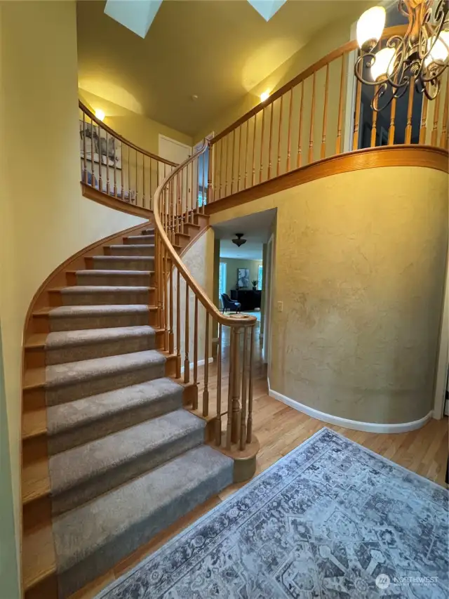 A stunning staircase is a focal point of this lovely home.