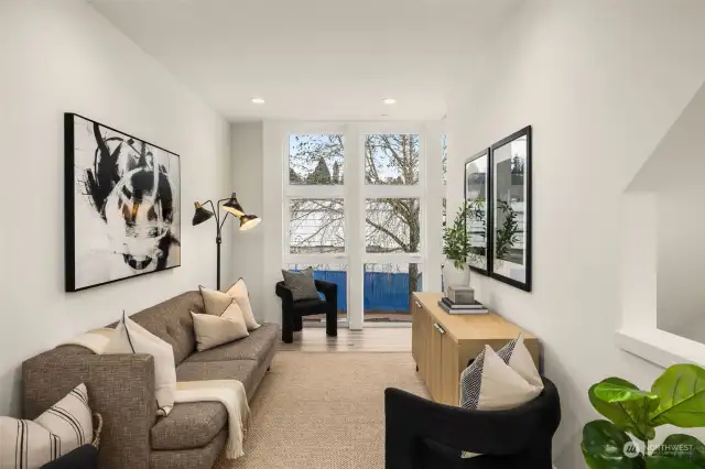 Livingroom with floor-to-ceiling windows.