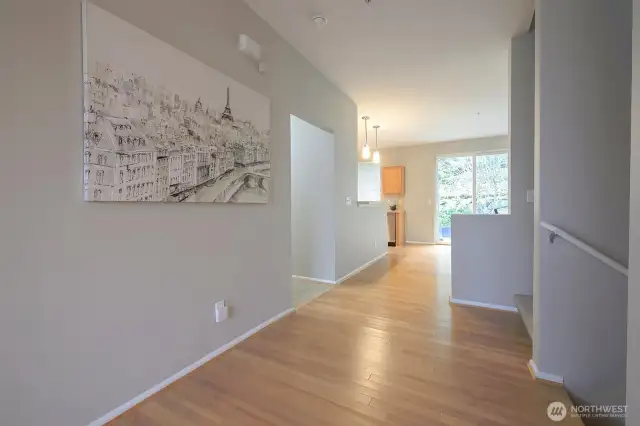 A transitional hallway connects common areas while maintaining openness and easy circulation.