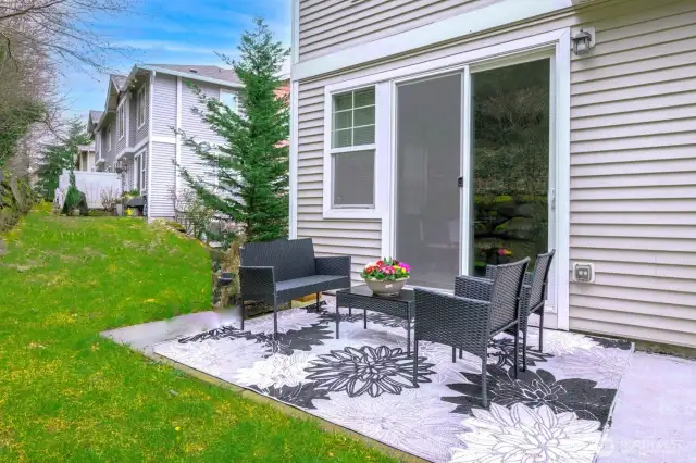 Morning light and forested views make this private outdoor space perfect for coffee or conversation.