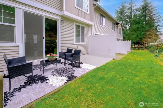 A peaceful, fenced patio offers room to relax, garden, or entertain—sheltered and serene.