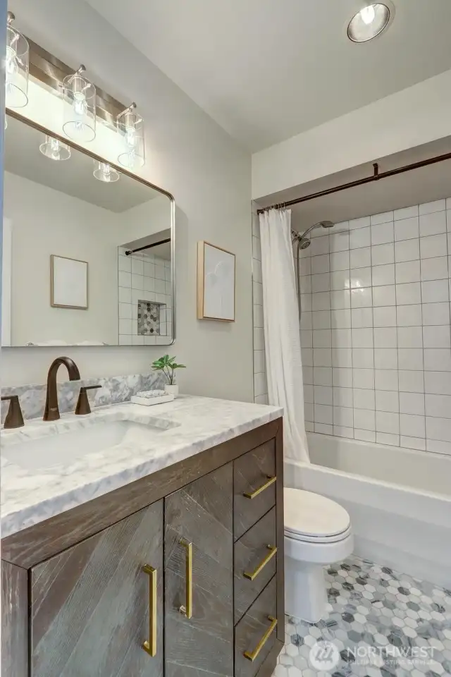 The marble tile floor complements the marble countertop...