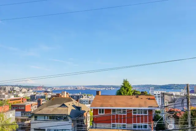 Count the ferry boats scudding across the sound, and cloud-hats on Mt Rainier...