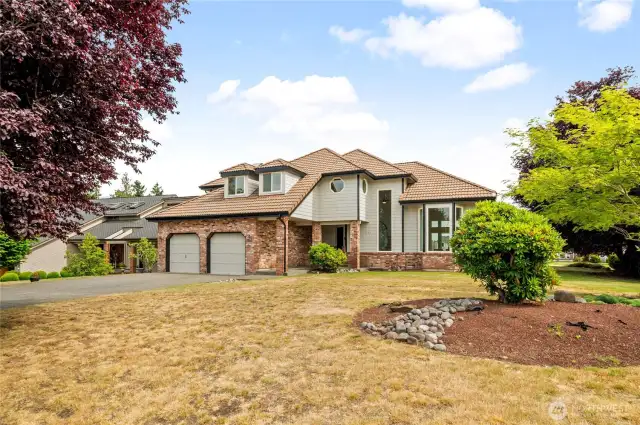 A stately residence, elegantly enhanced with a crisp new exterior finish.
