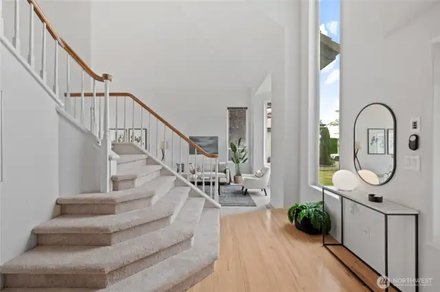 The entry unfolds into beautifully appointed Living and Dining spaces, perfect for entertaining.