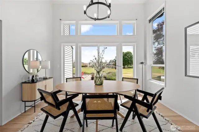 An entertainer’s dream—this Formal Dining Room offers grandeur with vaulted ceilings and a backdrop of the 4th fairway and Mount Rainier from the adjoining patio.