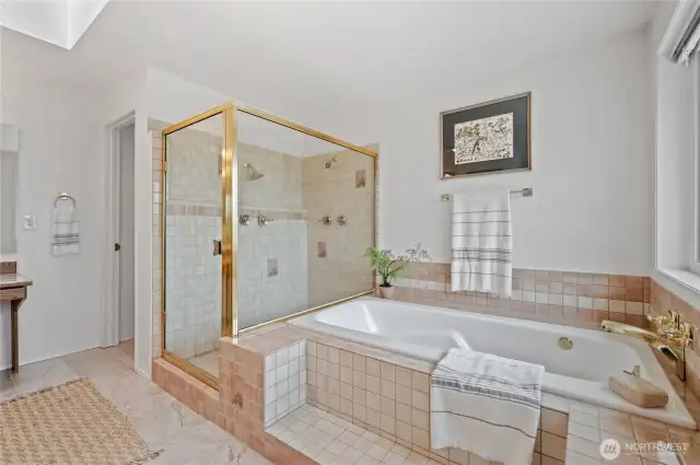 The luxurious Primary Bath includes a soothing jetted tub, a spacious shower, a discreet water closet, and dual vanities that blend style with convenience.