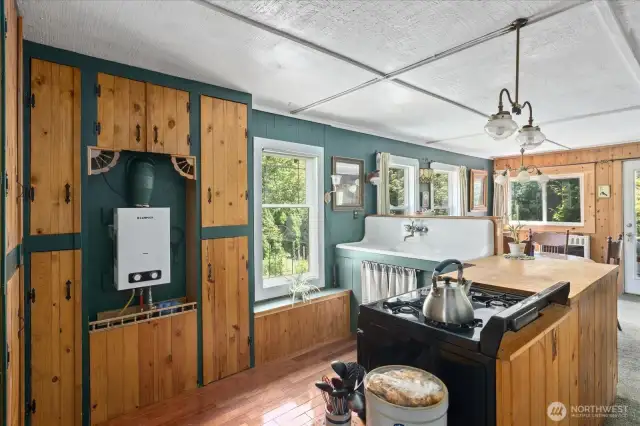Kitchen with instant hot water heater. to the left.