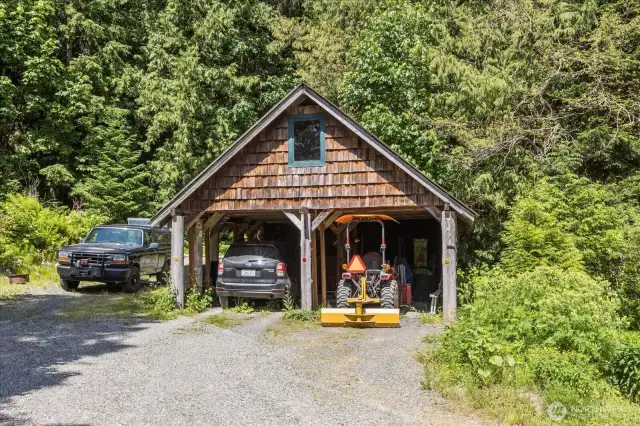 Carport and shop in the back of building.