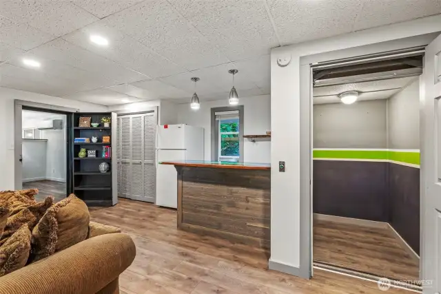 Elevator (to garage) and epoxy bar top! This room has it all!