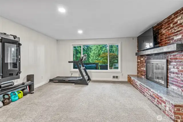 Living Room with Wood Fireplace (downstairs)