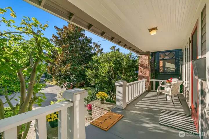 The charm here abounds - just look at this adorable, covered front porch with two seating areas! Catch the sunset skies from here nightly.