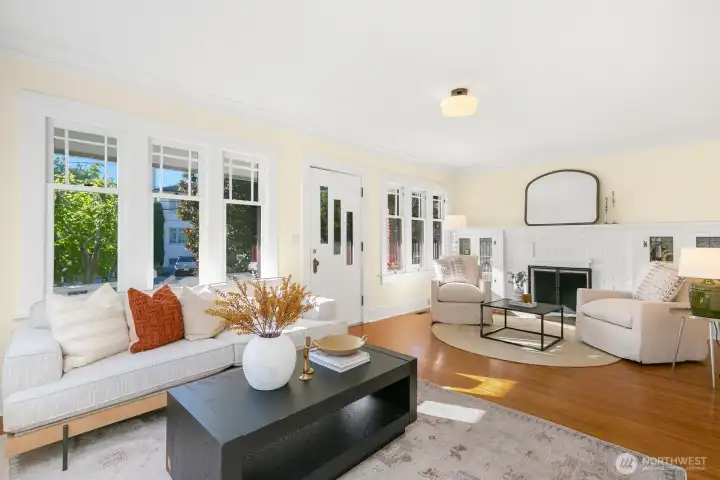 Enter into the living room which also has two seating areas. Wood burning fireplace is perfect for the cozy nights!