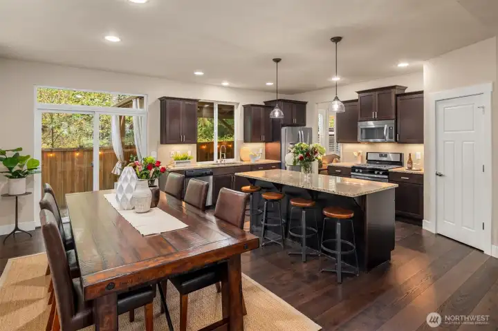 Open concept on the main floor between kitchen, dining, & living rooms