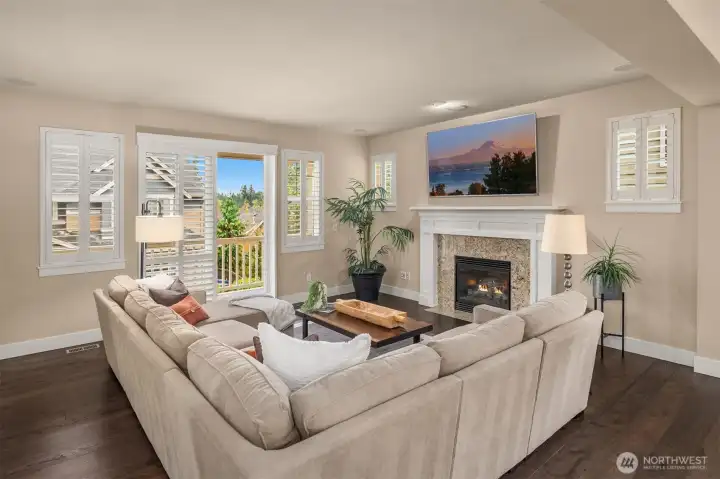 Feat. elevated window covers throughout w/ plantation shutters