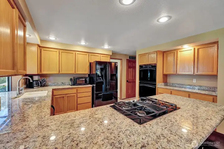Gorgeous granite countertops, built-in stove top and double ovens