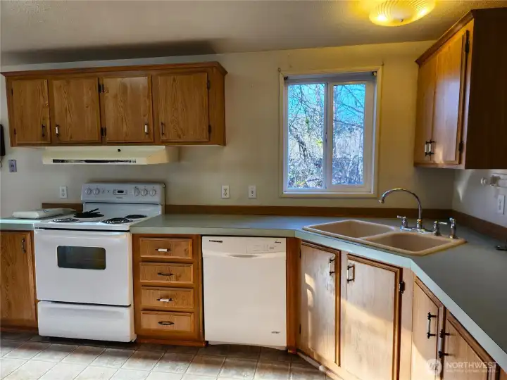 Great kitchen layout with ample light and plenty of cabinets.