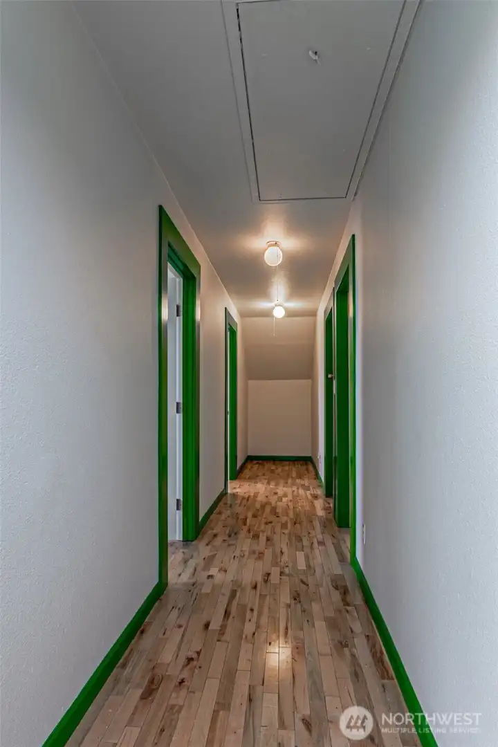 Four bedrooms (total of six bedrooms with additional 2 on the main floor), 3/4 bath & access to finished attic on this level.  Wide hallway allows for getting by stairway ladder when pulled down.