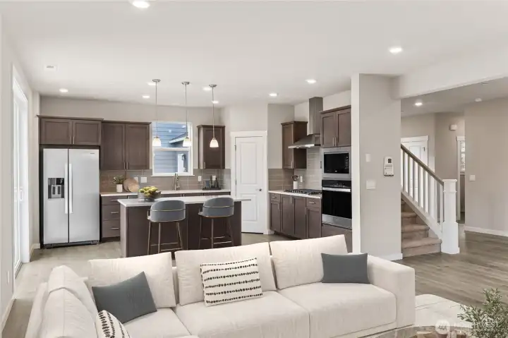 Welcome home! Gourmet kitchen with gas cooking.  Refrigerator included. Photos are for representational purposes only. Colors and finishes may differ.