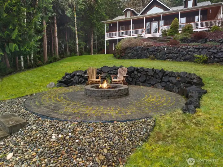 Fireplace with steps down to it from the house. Sit around and enjoy smores.