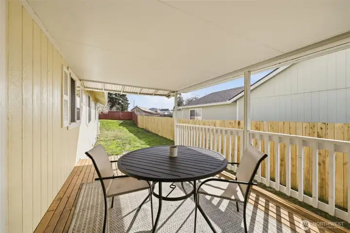 Outdoor covered deck—perfect for BBQs and enjoying warm summer afternoons.