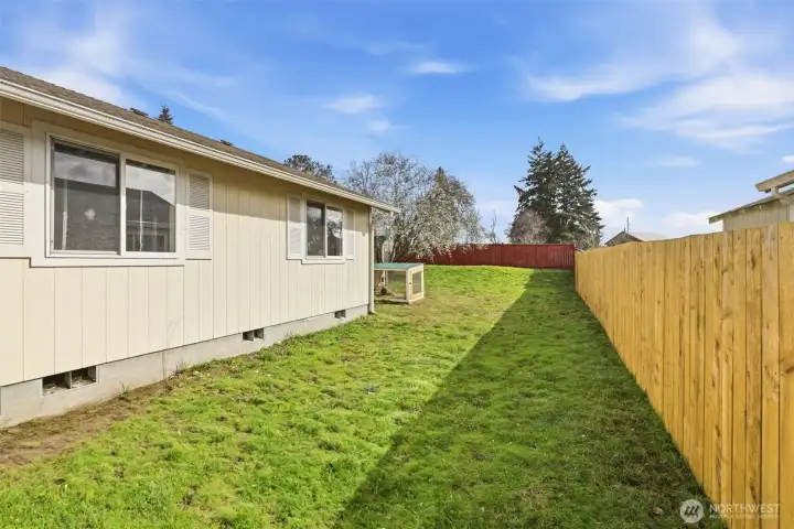 Expansive backyard offers endless possibilities—create a garden oasis, play area for kids and pets, or a relaxing space to entertain friends and family.
