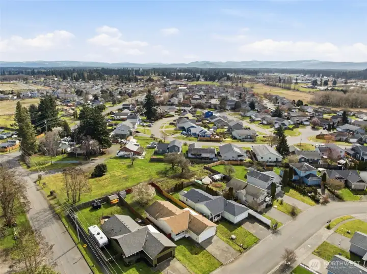 Aerial photos showcase the surrounding neighborhood and convenient location.