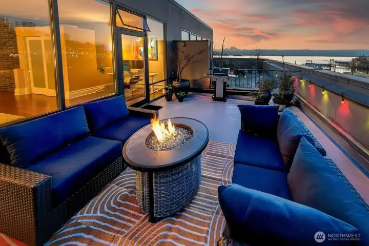 View Rooftop Terrace above Our Home Condominiums, where ferries cut across Elliott Bay and the day slows down