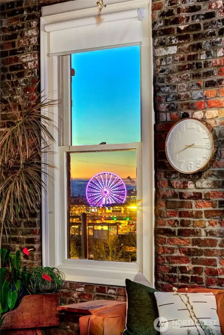 Penthouse View Lounge framing the Seattle Great Wheel and Elliott Bay beyond