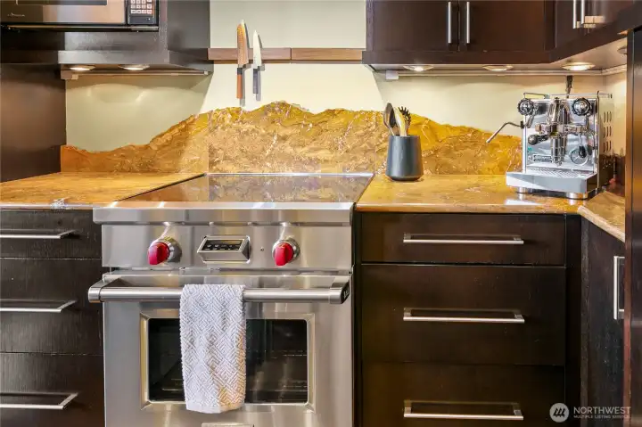 Kitchen set within the historic structure of the former Our Home Hotel, where original character carries forward