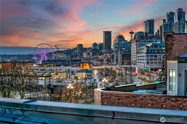 Private View Lounge at dusk, when Pioneer Square softens and the city lights take over