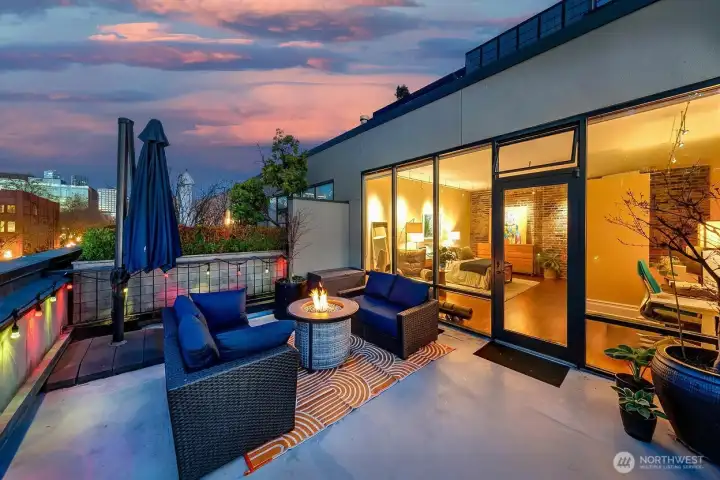 View Rooftop Terrace framing rail lines, piers, and the working edge of the waterfront