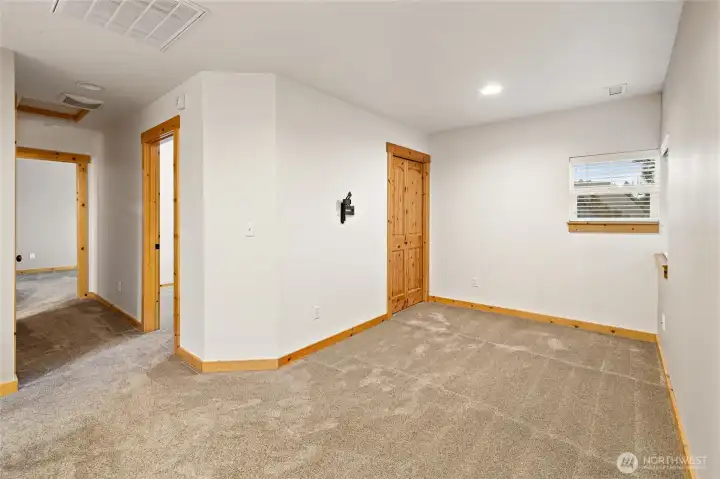 Versatile loft offers flexible living space with potential to enclose for a third bedroom.