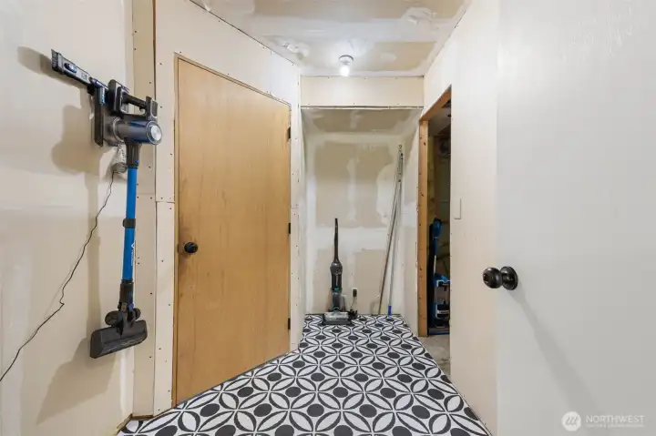 Utility room with laundry and garage access