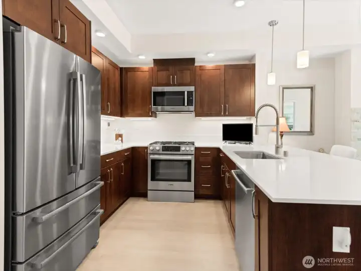 Many upgrades in this home include a flat surface breakfast bar...giving you more room for prep and it is esthetically so much more pleasing. Gotta love the under Many upgrades in this home include a flat surface breakfast bar...giving you more room for prep and it is esthetically so much more pleasing. Gotta love the under