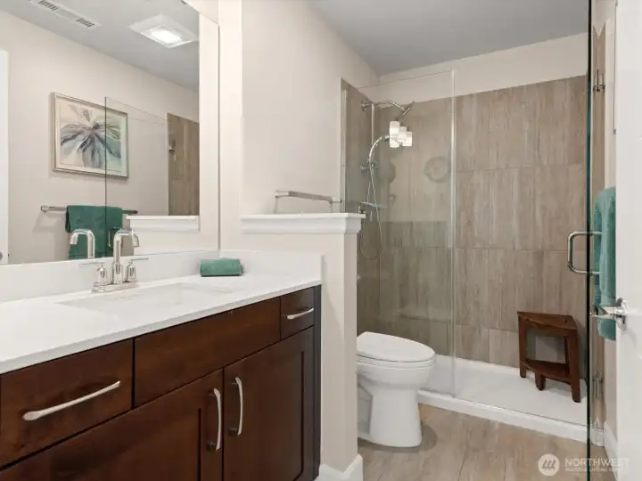 Tile surround in the shower and easy-swing shower door. Tile surround in the shower and easy-swing shower door.