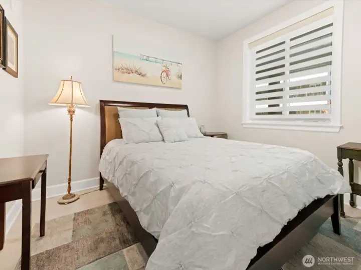 2nd bedroom- There are beautiful shades on all the windows. 2nd bedroom- There are beautiful shades on all the windows.