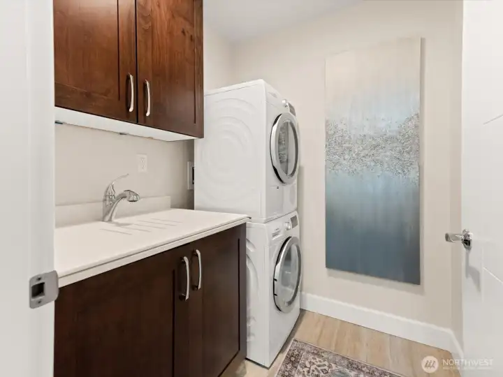 The laundry room sink has a removable cover so it can be used for a folding area for the included washer/dryer. Great storage above and below. The laundry room sink has a removable cover so it can be used for a folding area for the included washer/dryer. Great storage above and below.